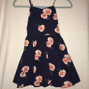 Dark blue dress with flower pattern.